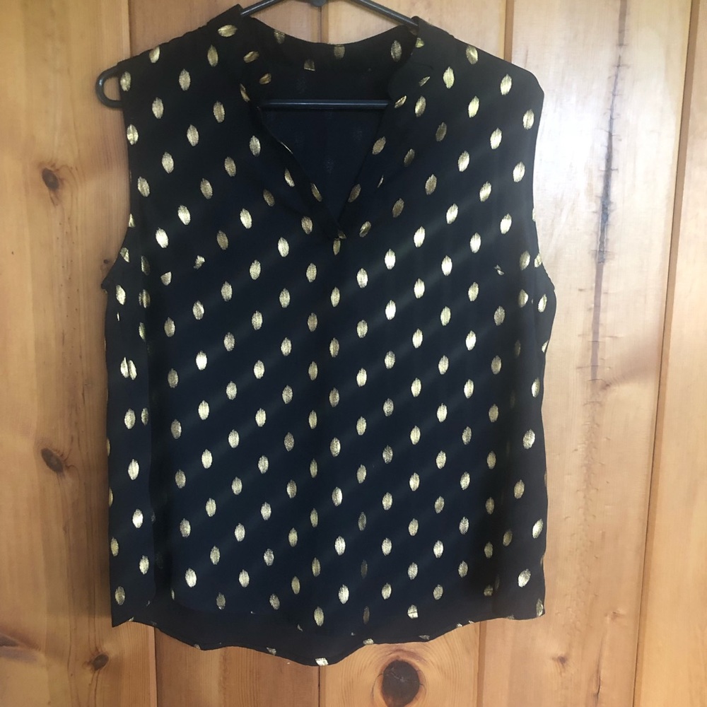 Black sleeveless loose fitting top with gold leaf print